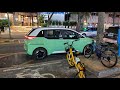 Illegally parked BYD D1 Didi exclusive ride-hailing electric car driving away