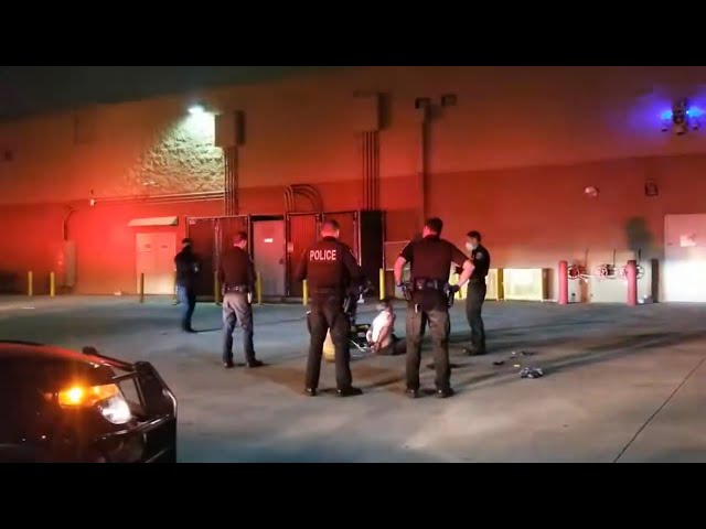 WOMAN DETAINED IN HANDCUFFS ON BACK OF WALMART IN FONTANA