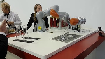 Kuka robot serves a Paulaner beer