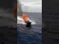 Hyper-realistic slow-motion then real-time transition. CIWS turret rotating with visible mechanical