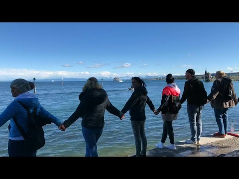 Anti-mask protesters form human chain in Konstanz, Germany | AFP