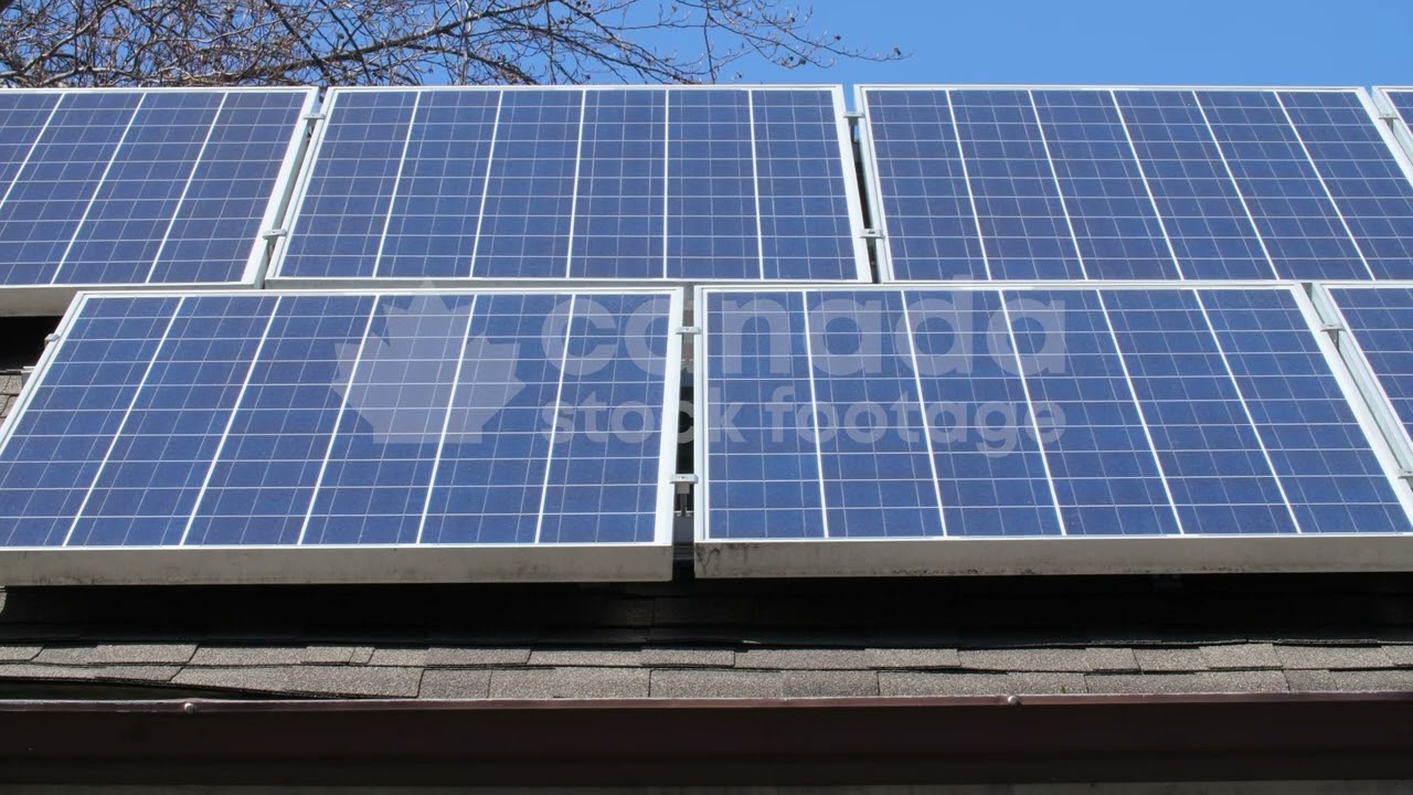 Solar panels on roof of suburban home stock video. Toronto, Ontario, Canada. 4K Royalty Free.