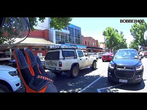 Road Rage 29 - Biker and driver communicate with sign language.