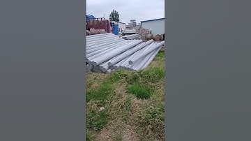 The process of unloading utility poles