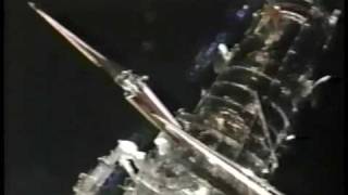 NASA STS-61 UFOs zoom by spacewalkers!