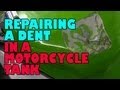 Repairing a dent in a motorcycle tank