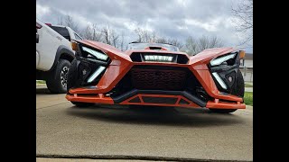 Installing a coil cover and lower accent panel from DDM Works on the Polaris Slingshot