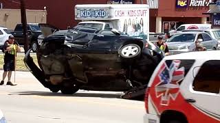 Wrecker Flipping Vehicle Back On Its Wheels After Rollover Accident