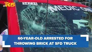 Man arrested after throwing brick at Seattle Fire Department truck held on $75,000 bail