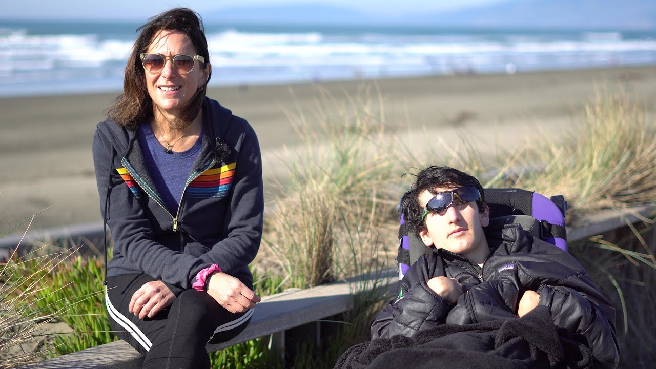Mother with disabled son enjoys walks and runs along the ocean, thanks to car-free community spaces
