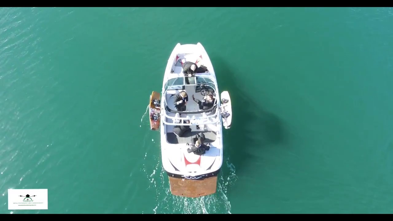 Groom arrives bond style to own wedding by wakeboarding down Menai straights