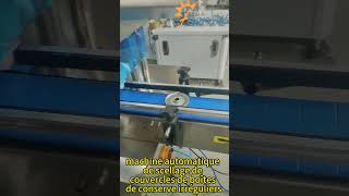Machine automatique de sertissage de couvercles de boîtes métalliques de formes irrégulières