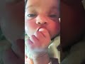 baby licking hand