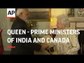 Queen Elizabeth II greets the prime ministers of India and Canada as they arrive to attend Commonwea