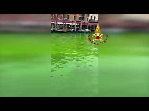 Italian authorities investigate after canal turns fluorescent green