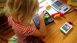 K completes a Rush Hour Jr. beginner level puzzle