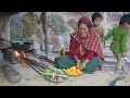 Village mother is cooking delicious food items  nepali village