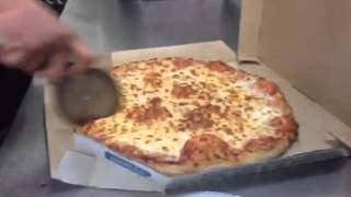 Dominos readies pizza for Maloney High School lunch