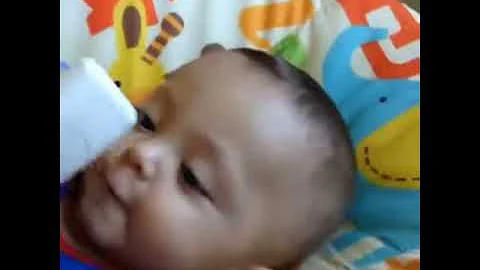 Silly baby boy talking on the phone