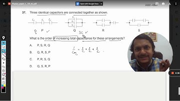Three identical capacitors are connected together as shown.