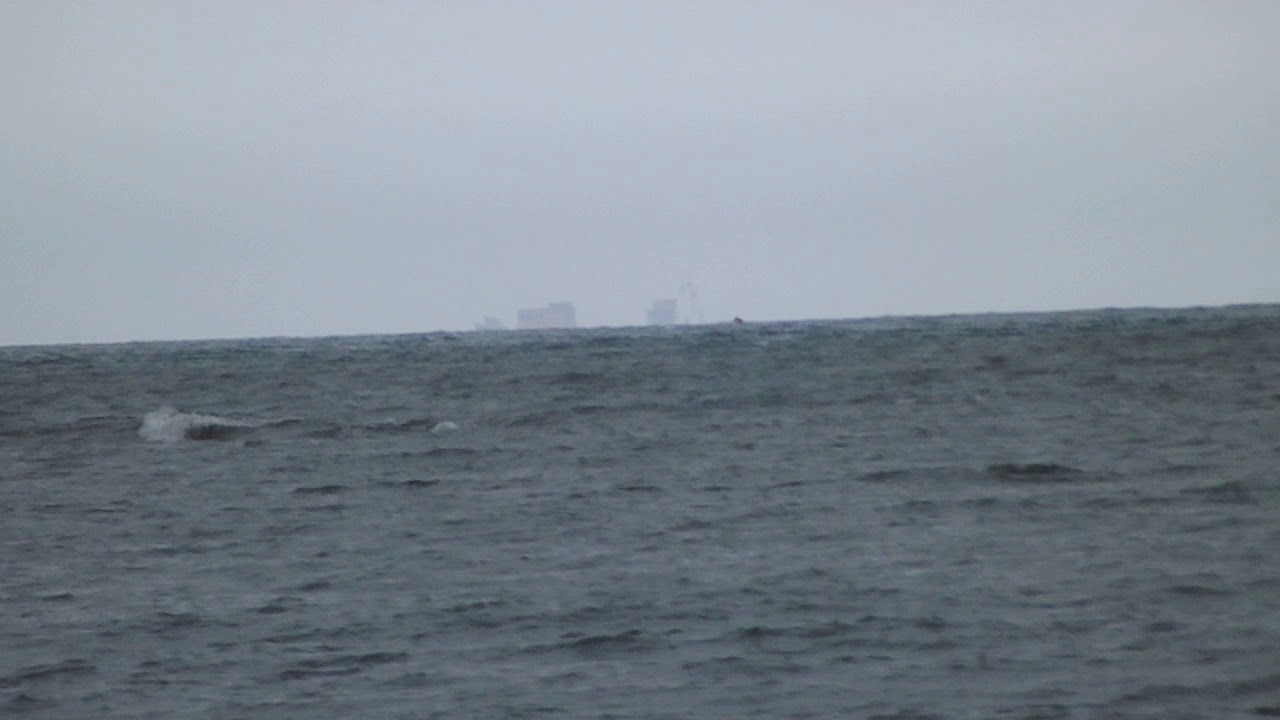 Container Ship Half Below North Sea Horizon
