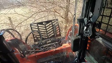 SVL75 with a Danuser Intimidator ( Big Hedge Tree )