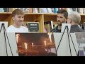 Fans, photographer and players at the 2025 Timbers Year in Photos Art Show at Powell's City of Books