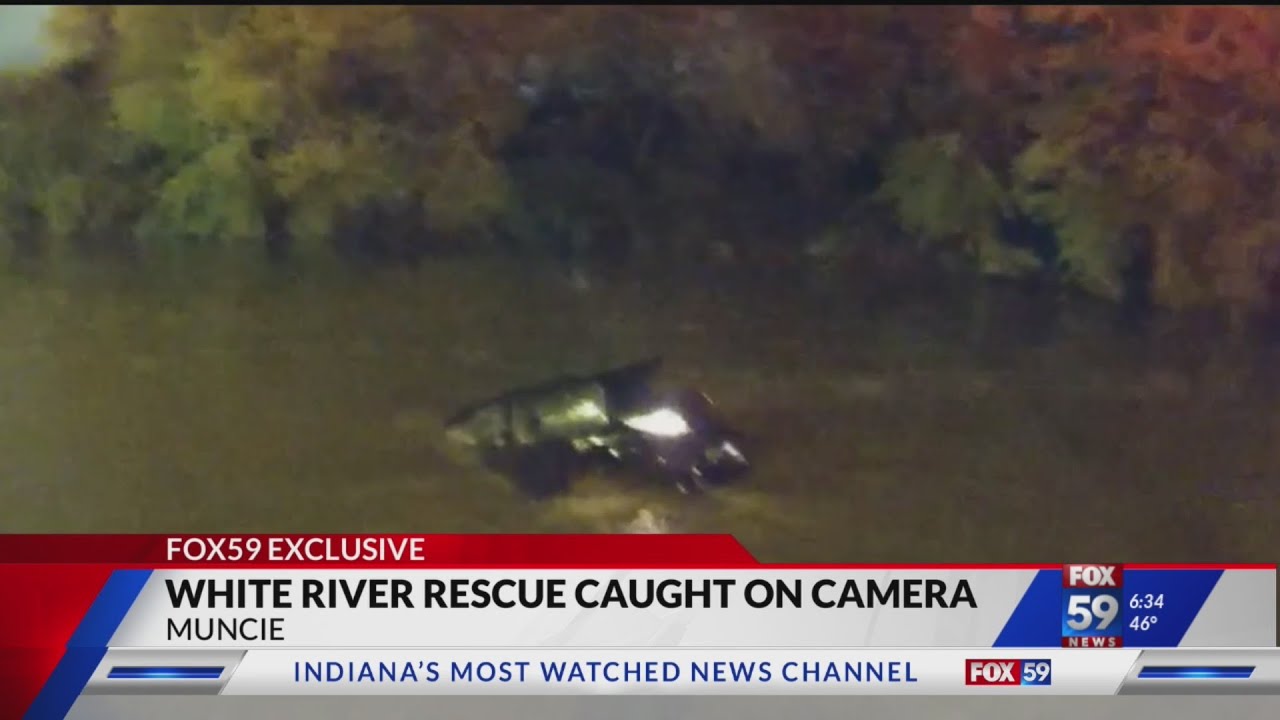 CAUGHT ON CAMERA: Officers jump into river, rescue woman from sinking ...