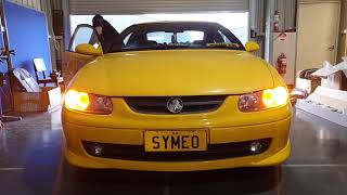 Holden Monaro Chev VT WH VX custom headlights LED halo rings HID LED upgrade switchback rings bulbs