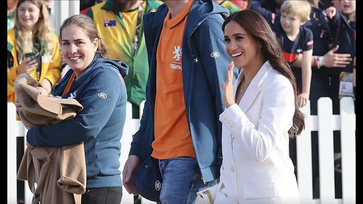 Cute moment: Meghan gives her coat to baby