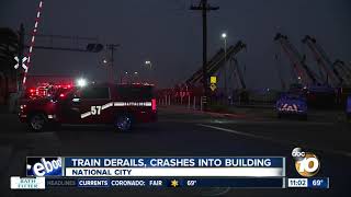 Train derails, hits building in South Bay