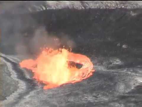 Eruption after person throw stone in lava lake of volcano