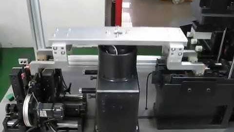 Two station armature balancing machine