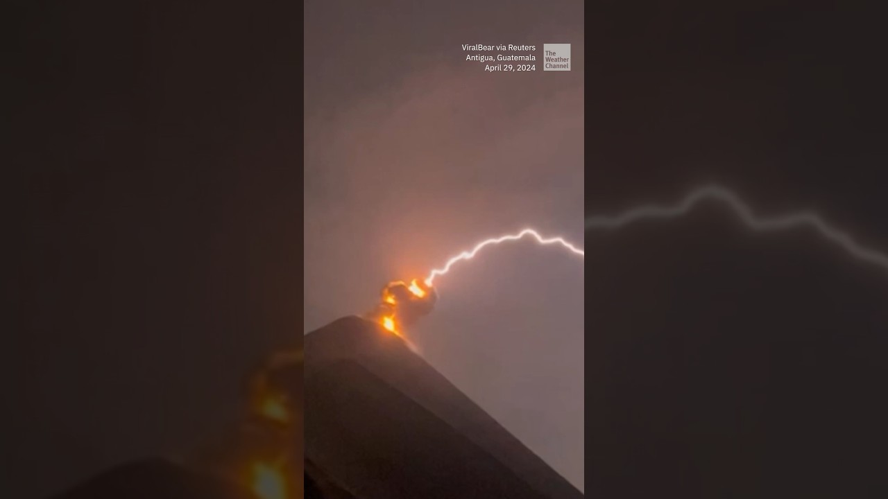 Lightning appears to strike erupting volcano