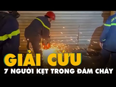 Video Cảnh sát cắt cửa cuốn cứu 7 người mắc kẹt trong thẩm... - youtube