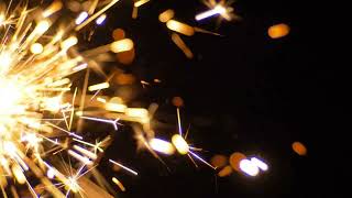 The bright stream of a sparks on a dark background slow motion - 4K screenshot 5