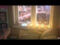 The sound of rain in a bedroom with a city night view
