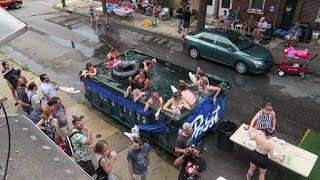 Partygoer Turns Dumpster Into a Swimming Pool For The Whole Street