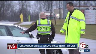 Greenwood police officer hit by car while directing traffic