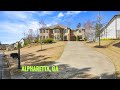 Tour this luxurious 5 bedroom 62 bath home wpool in a gated golf course community in alpharetta ga