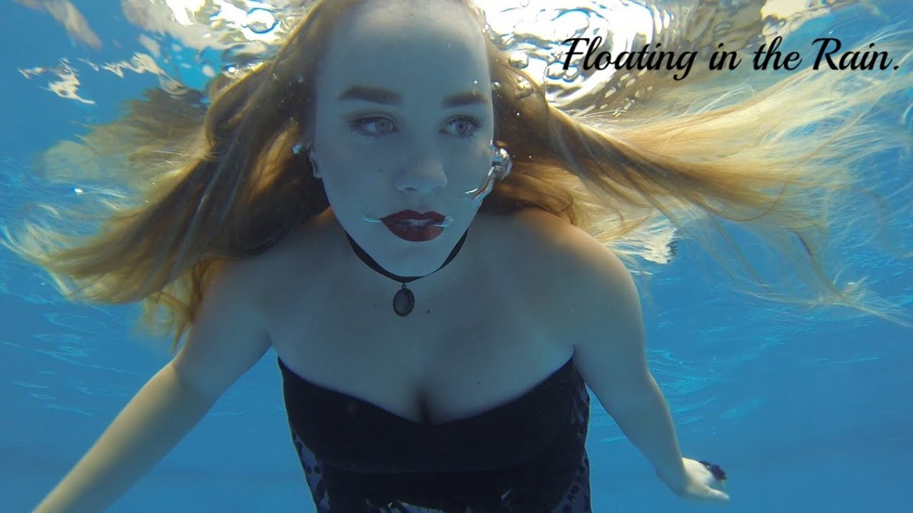 Gothic mermaid floats under the surface in the rain!🖤☔