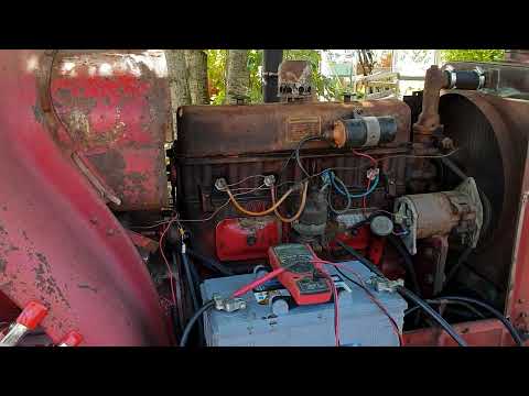 An old David Brown Prairie Cropmaster tractor is started for the first time in many years