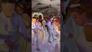 Brides maid and grooms men dance