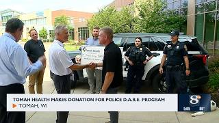 Tomah Health Makes Donation for Police D.A.R.E Program