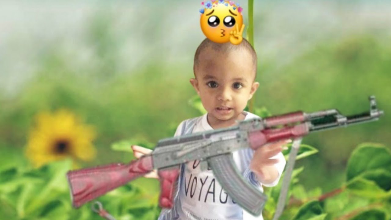 baby playing with gun. YouTube