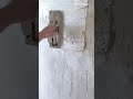 making a neat line pattern on a grey concrete floor surface using an industrial iron trowel block