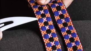Using the Sigga heddle to weave Sámi bands with two groups of pattern threads