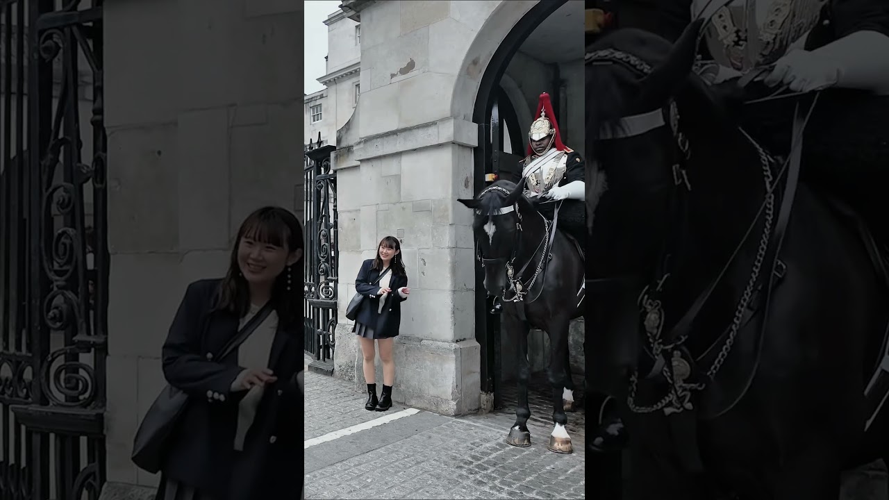 JAPANESE TOURIST PAYS RESPECT TO THE ROYAL GUARDS