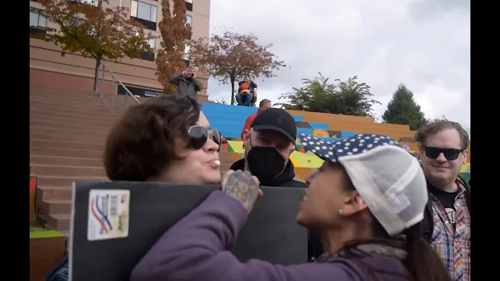 Far-left trans protester tries to spit on women's ...