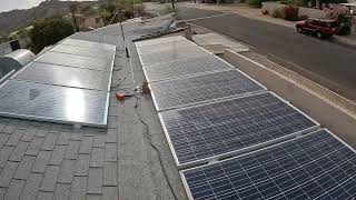 Tightening Z-Brackets, Flipping Solar Panel to mount on Roof, Cat inspects progress, GX020004